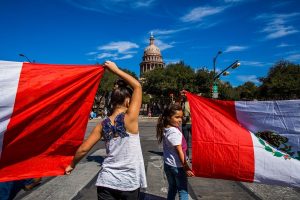 females holding flags
